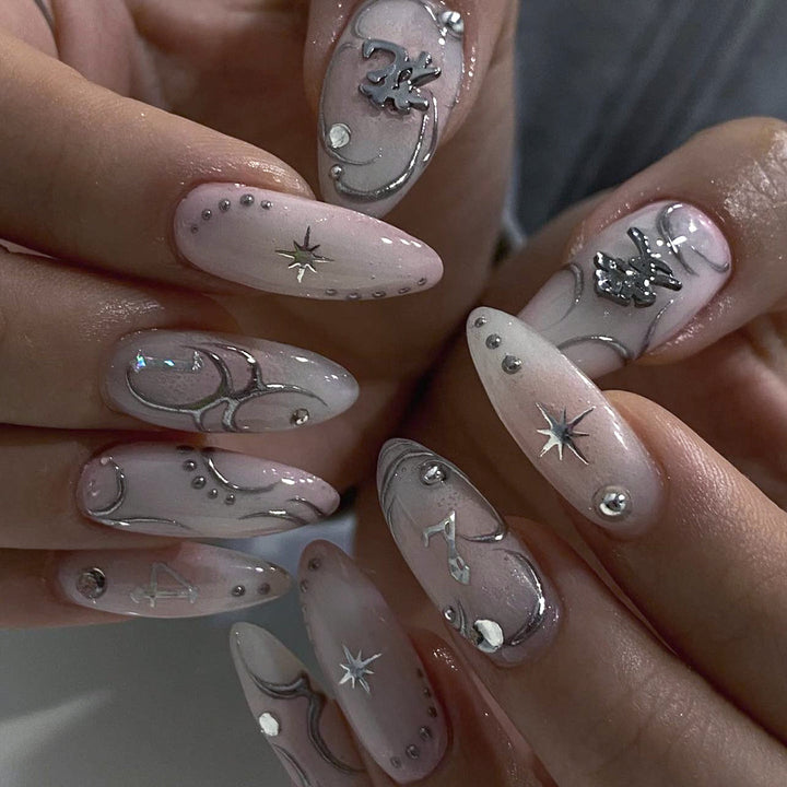 Artistic acrylic nails with elegant glitter patterns Stornfield