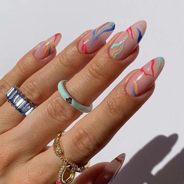 Artful nail extensions with an elegant leaf pattern Stornfield