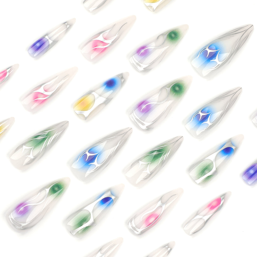 Artful stiletto nails with transparent design and colorful accents Stornfield