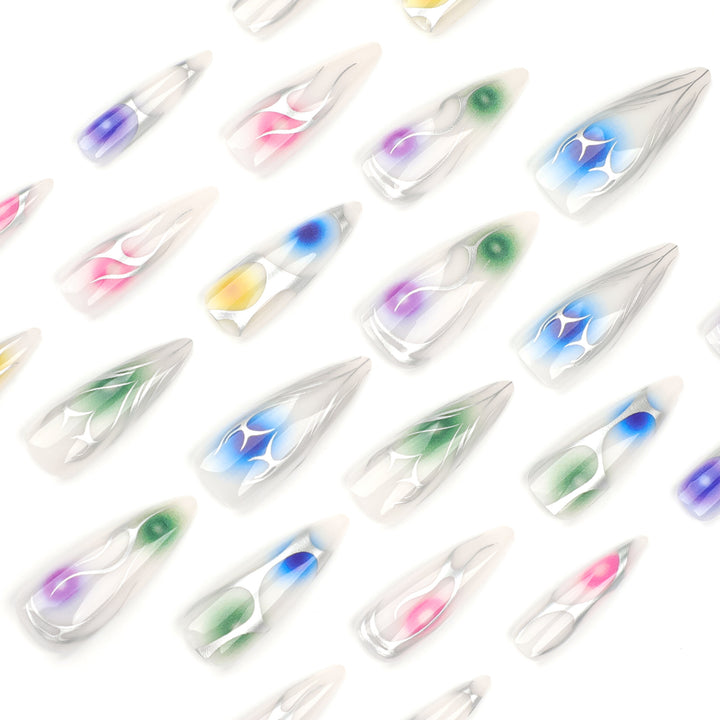 Artful stiletto nails with transparent design and colorful accents Stornfield