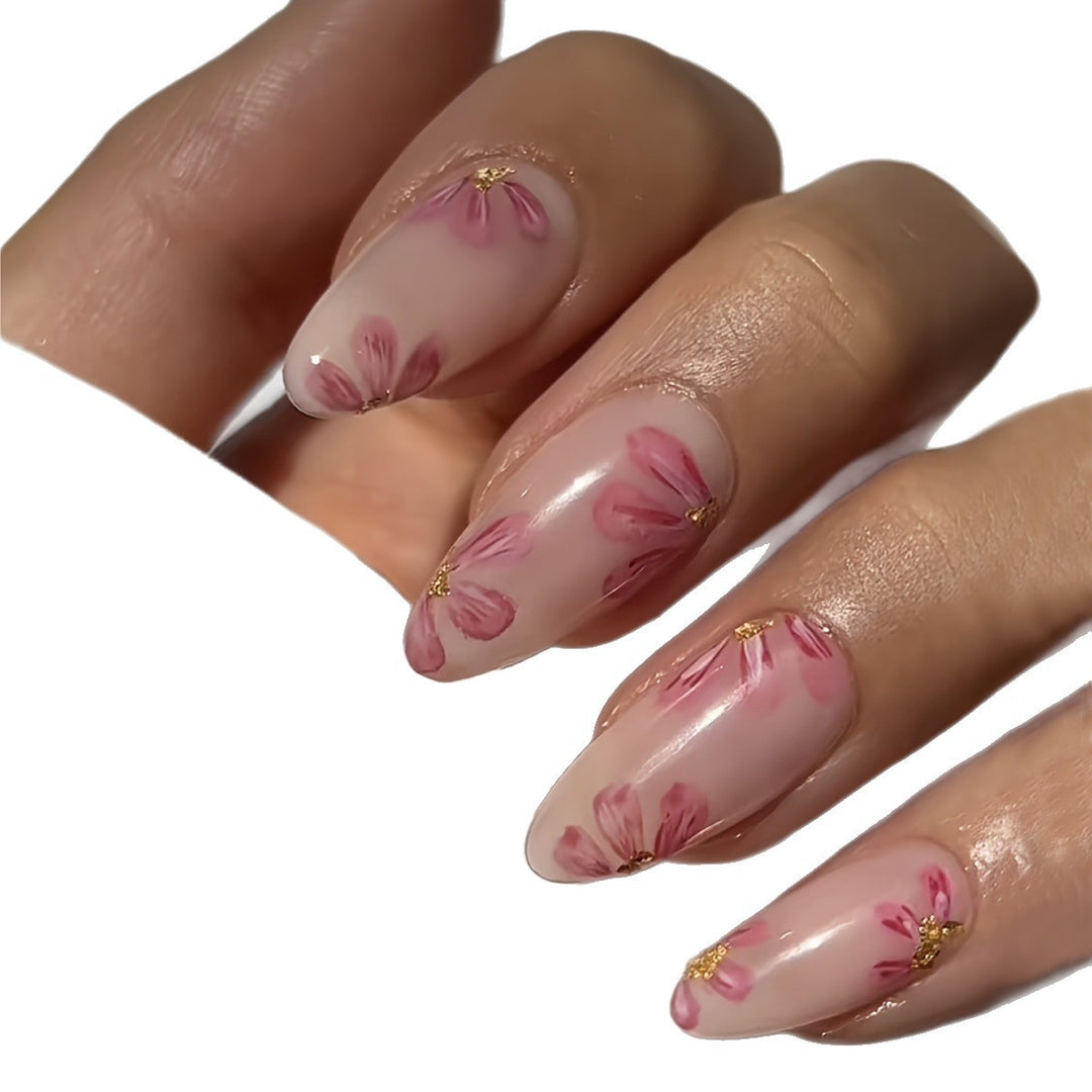 Artificial nail set with floral accents and gold embellishments Stornfield