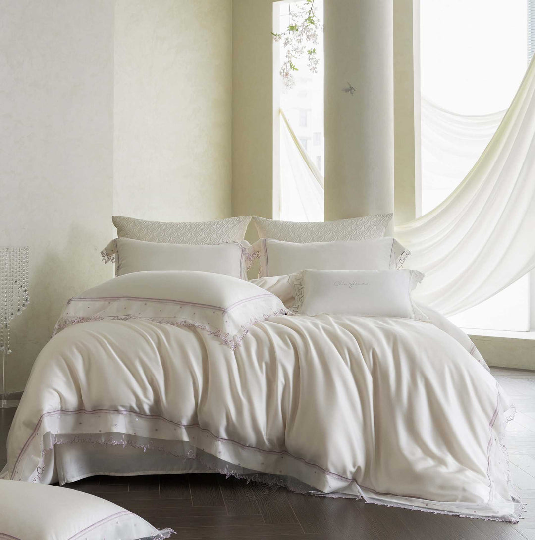 Satin bed linen set with delicate organza ruffle and lace trim