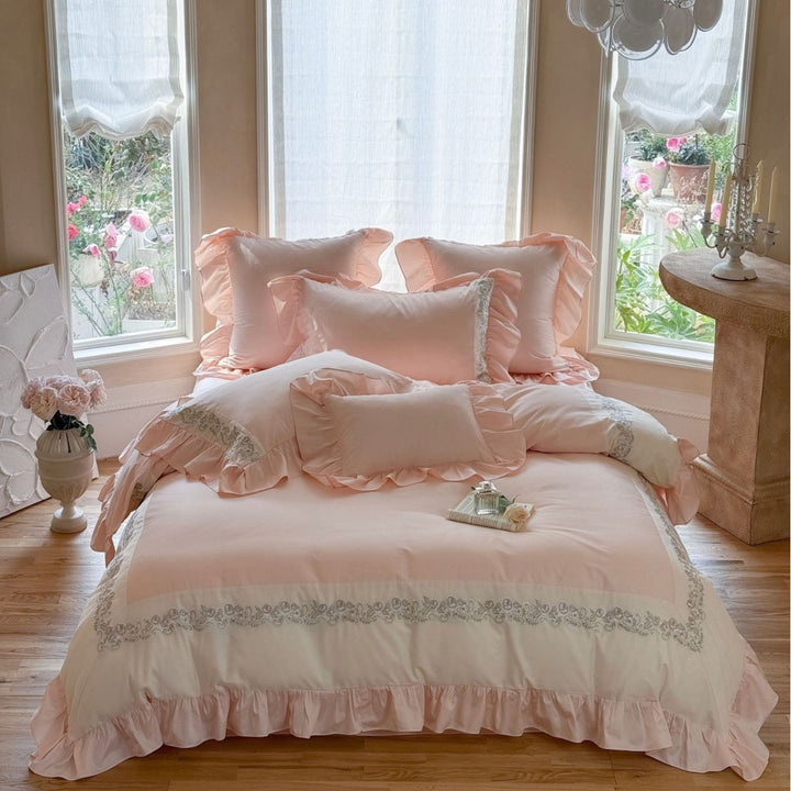 Designer bed linen set with ruffle hem and fine border embroidery