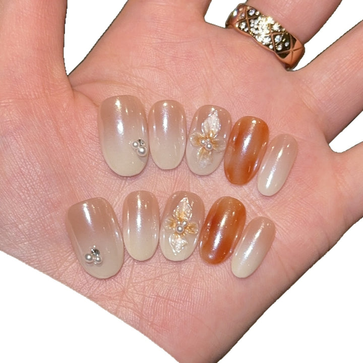 Artificial nails with floral details and glitter coating Stornfield