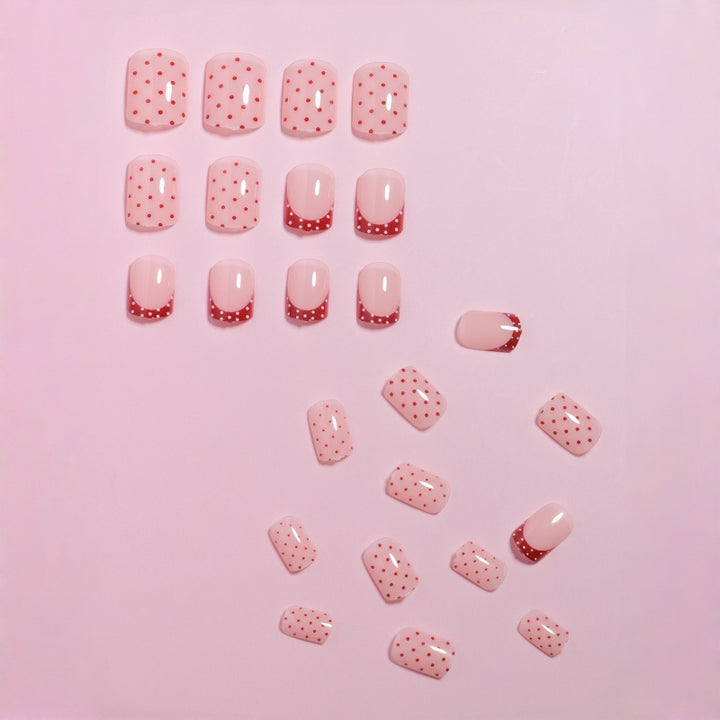 Stylish Press-On Nail Design with Polka Dot and French Tip Accents Stornfield