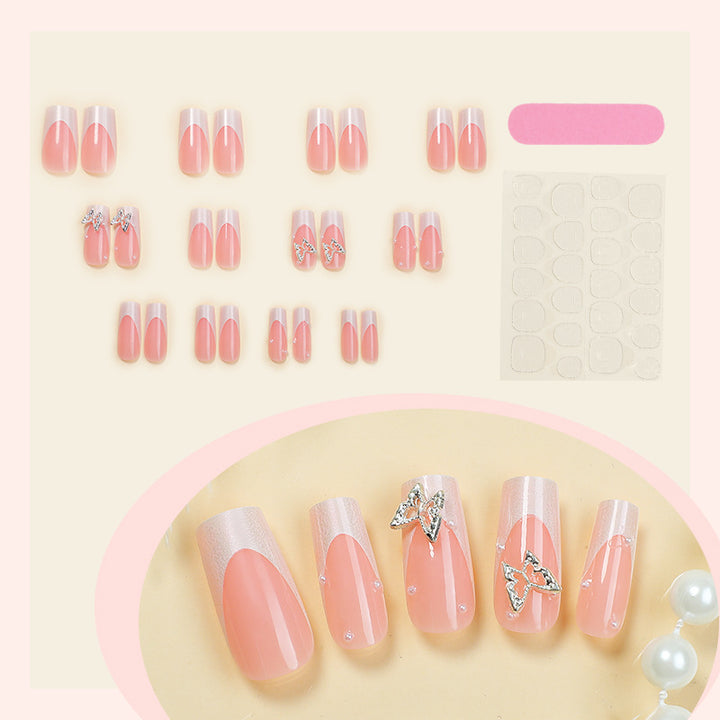 Nail art set with intricate designs and butterfly appliqués Stornfield