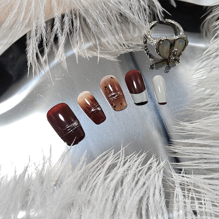 Trendy artificial nails with elegant metallic and gradient effects Stornfield