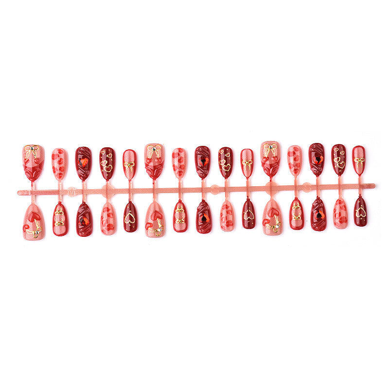 Festive artificial nails with romantic heart designs Stornfield