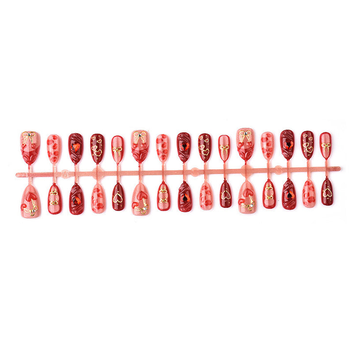 Festive artificial nails with romantic heart designs Stornfield