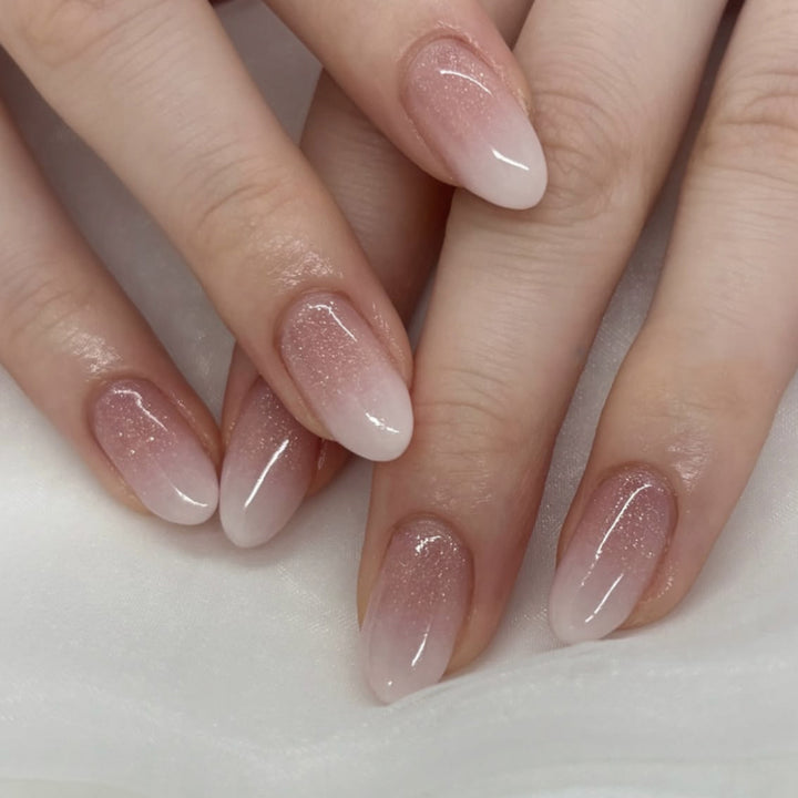 Luxurious nail extensions with elegant glitter ombre coating Stornfield