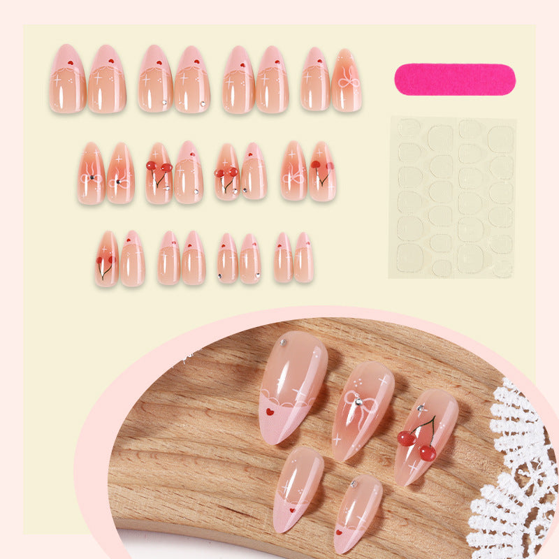 Artifical nails with playful heart and bow designs Stornfield