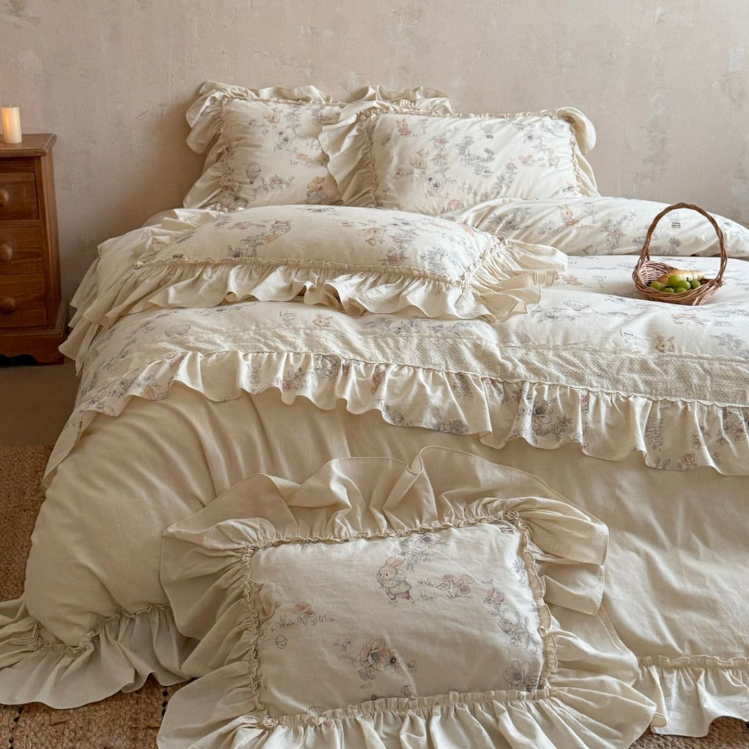 Romantic bedding set with ruffles, floral jacquard application and decorative cushions