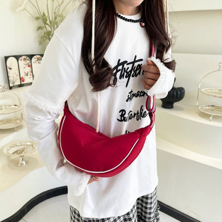 Fashionable shoulder bag with unique cut and adjustable strap Stornfield