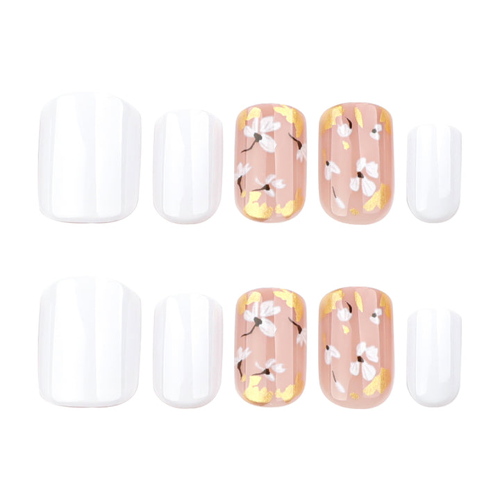 Artificial nail art with delicate flowers and glitter accents Stornfield
