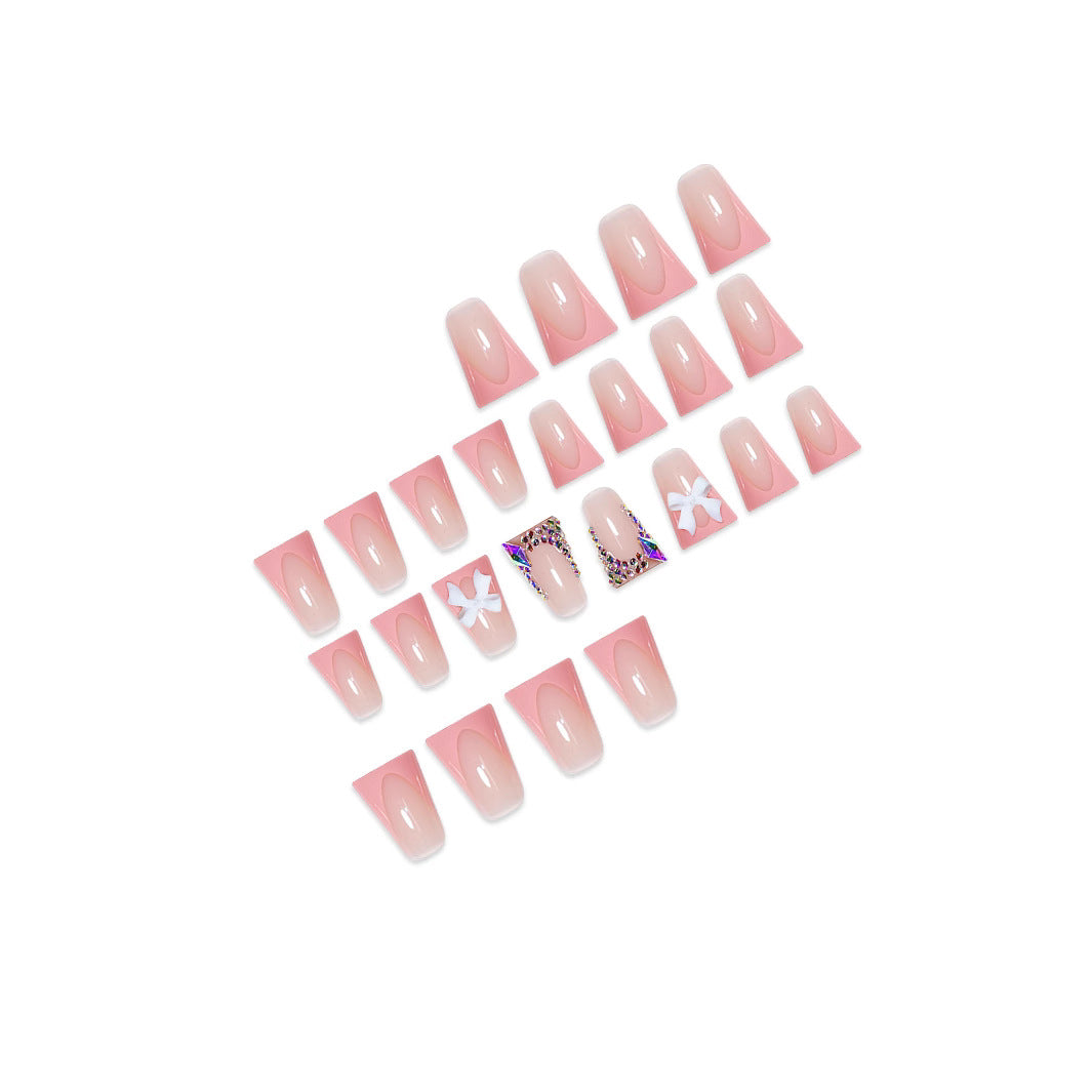 Decorative Acrylic Nail Enhancements with Bow and Rhinestone Accents Stornfield
