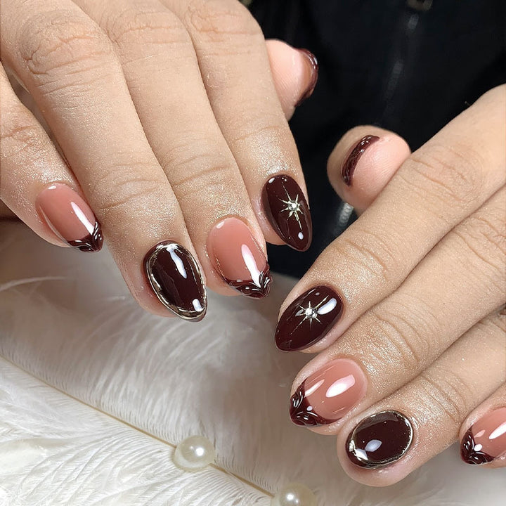 Acrylic nail set with elegant gradient and delicate embellishments Stornfield