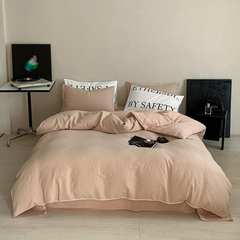 Textured cotton waffle duvet cover with pillowcases and fine contrasting piping