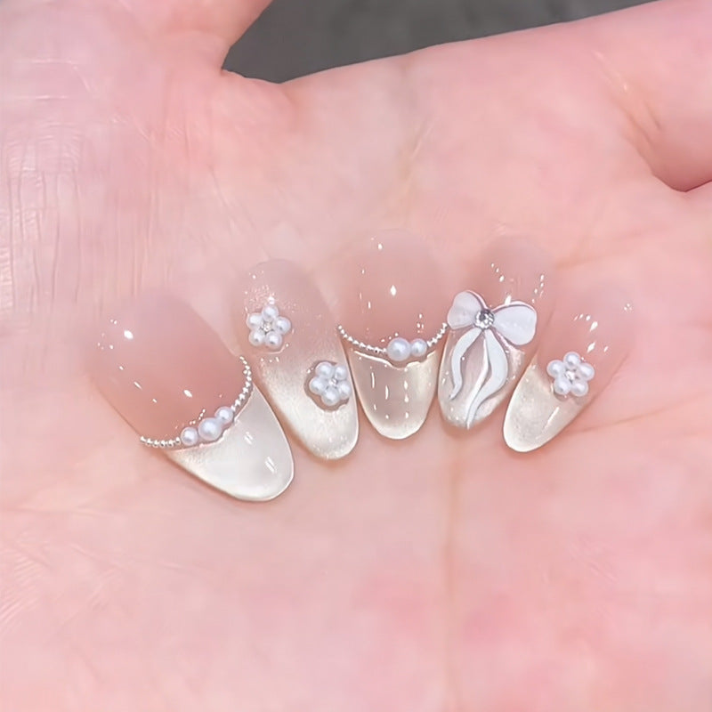 Artistic Nail Extensions with Decorative Elements Stornfield