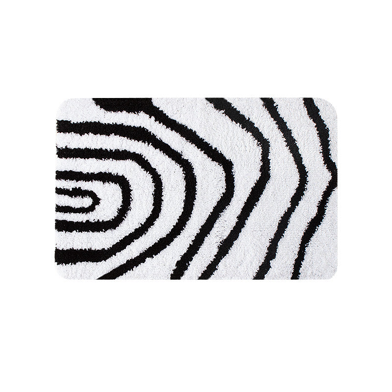 Fluffy bath mat in a graphic wave relief with anti-slip base Stornfield