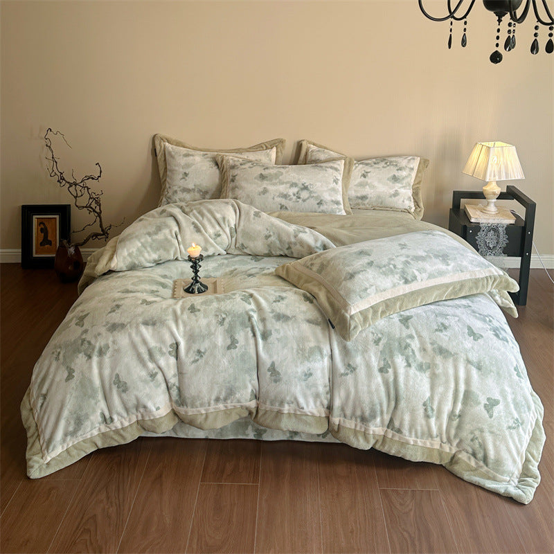 Luxurious quilted bedding set with velvet trim and floral branch motif