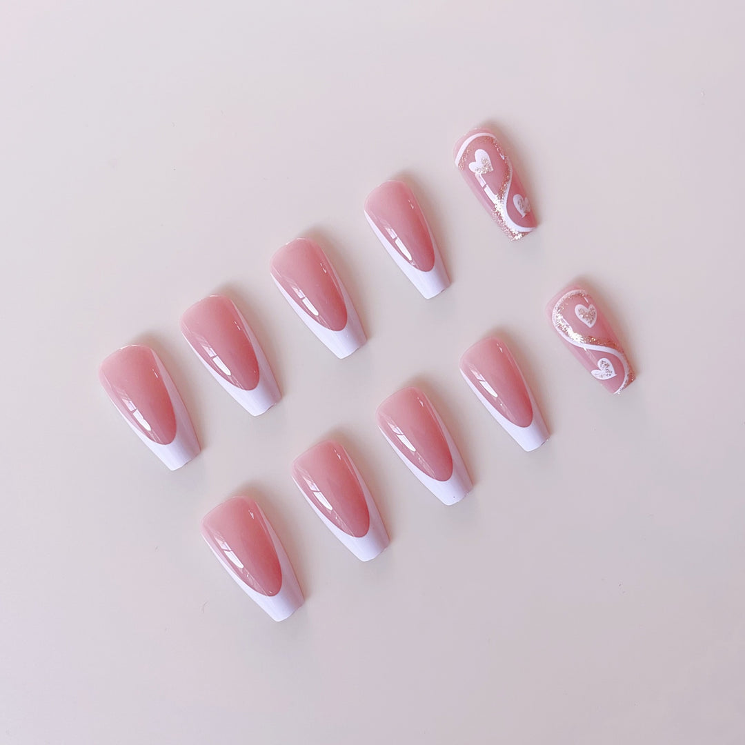 Artificial nail set with elegant heart decorations and glitter accents Stornfield