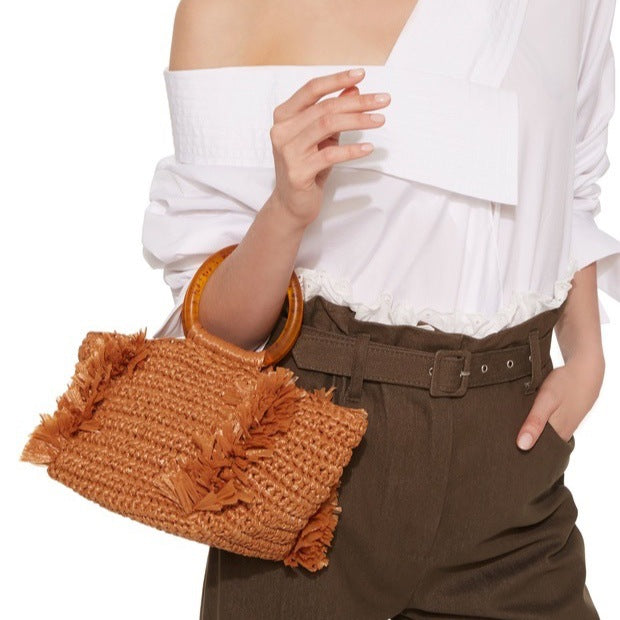 Handmade raffia shoulder bag with fringed accents Stornfield
