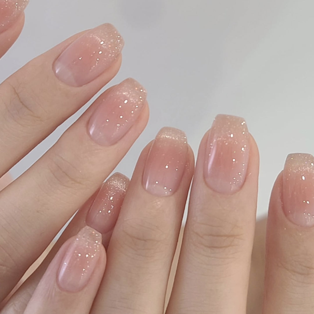 Elegant Nail Designs with Glitter and Gradient Stornfield