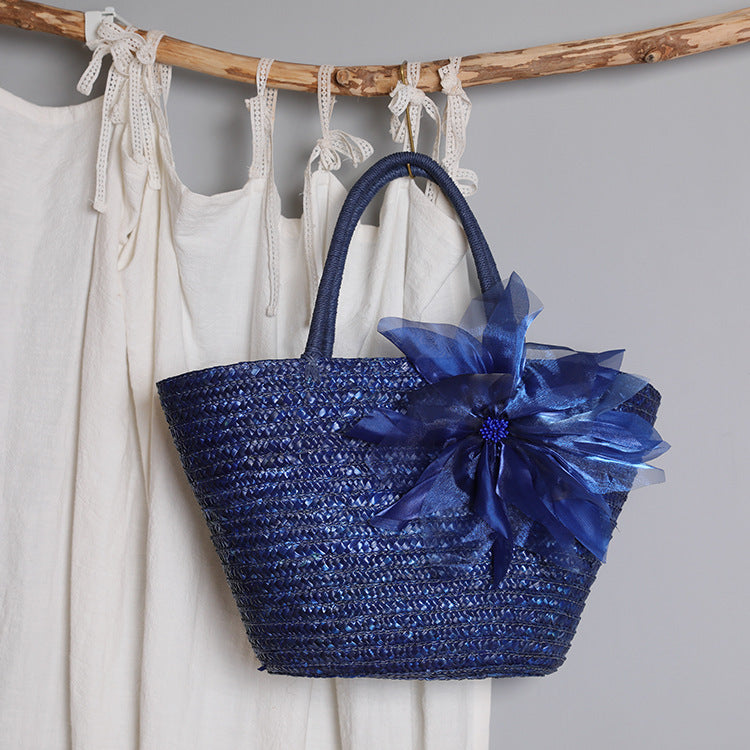 Stylish basket bag with eye-catching flower detail Stornfield