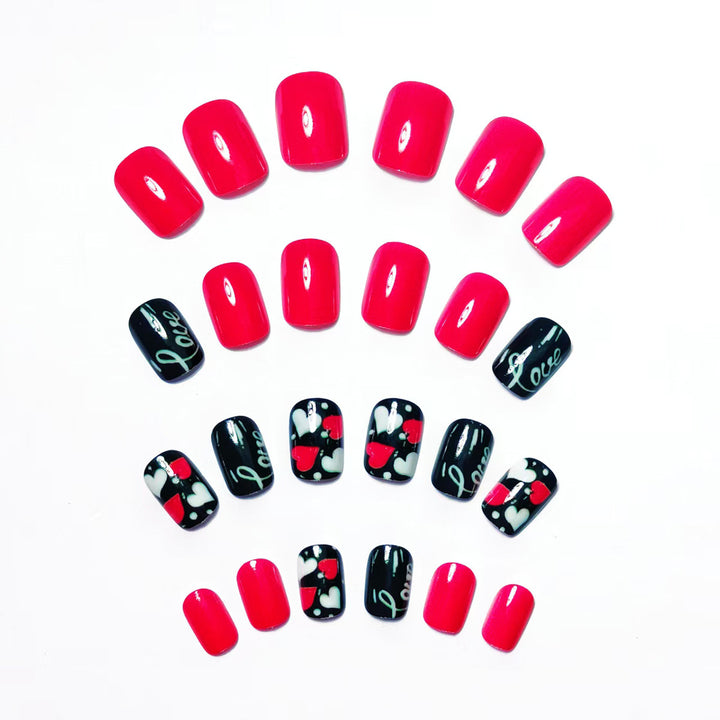 Acrylic nail design with hearts and kiss motifs Stornfield