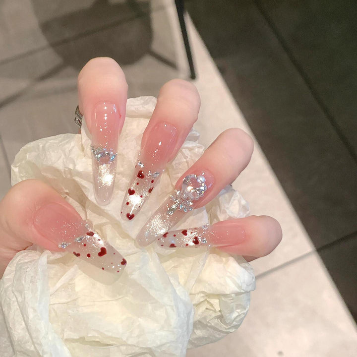 Nail art set with sparkling rhinestones and heart design Stornfield