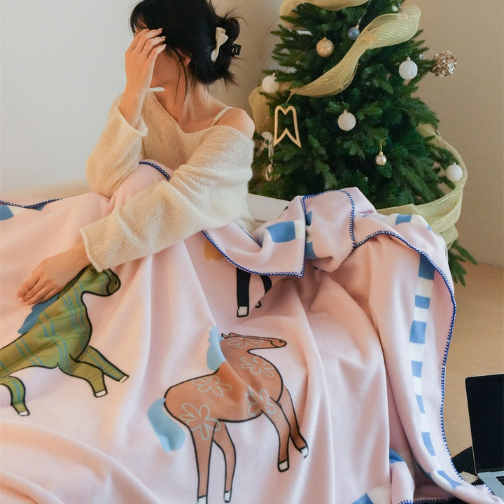Children's cuddly blanket made of soft fleece with horse print and decorative edge