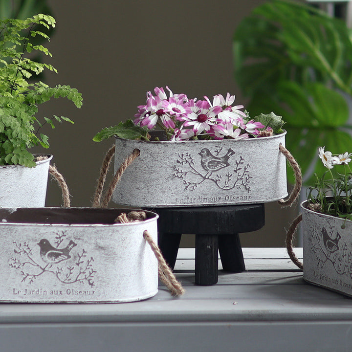 Decorative storage basket made of metal with natural design Stornfield