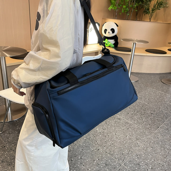 Sporty travel bag with reinforced carrying handles and multiple compartments Stornfield