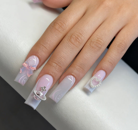 Artificial nails with delicate embellishments Stornfield