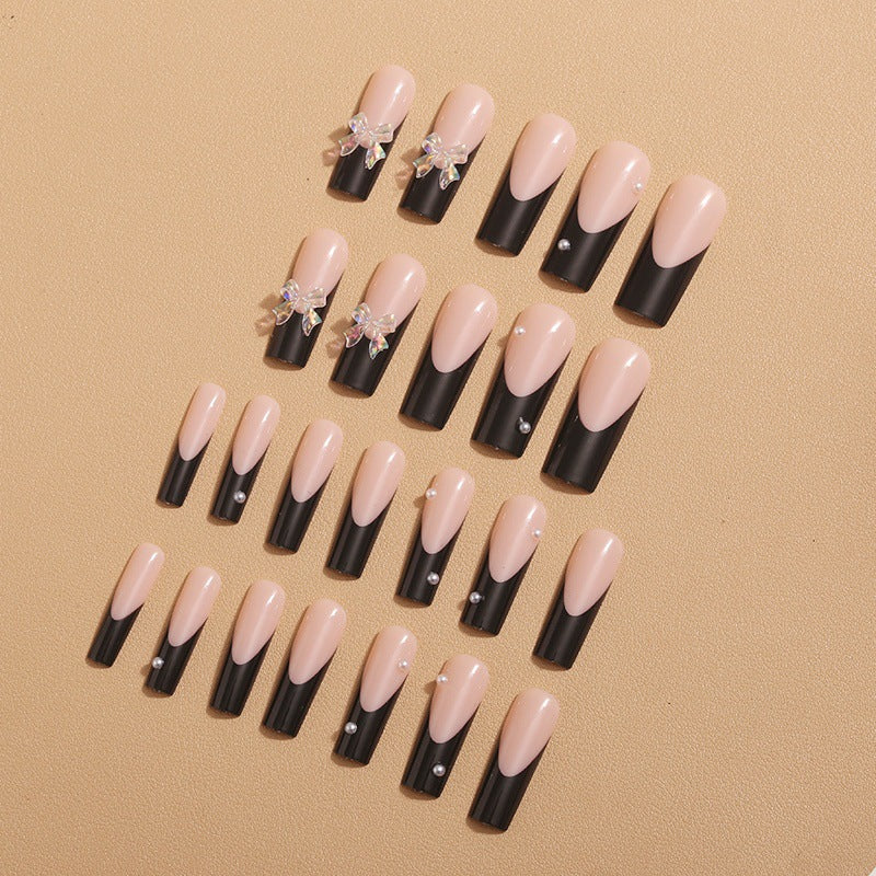 Nail decoration with elegant bows and rhinestones Stornfield