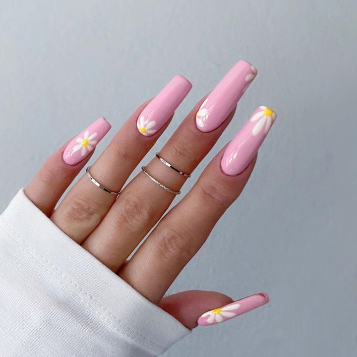Artistic acrylic nails with flower decoration Stornfield