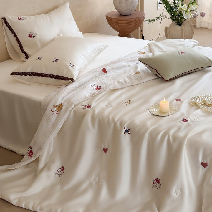 Elegant satin bedding set with fine floral embroidery and lace trim