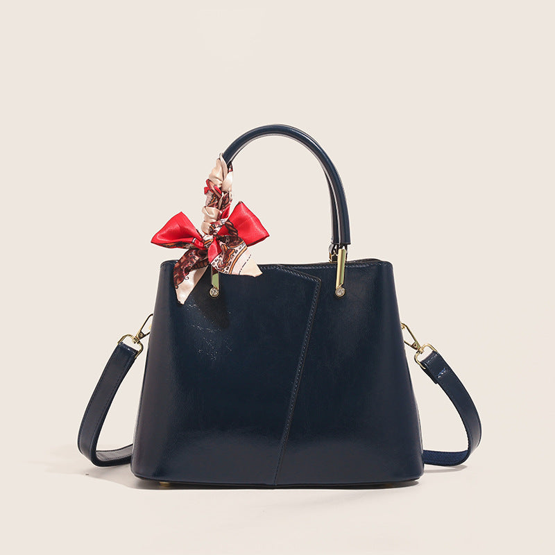 Stylish Structured Handbag with Decorative Scarf