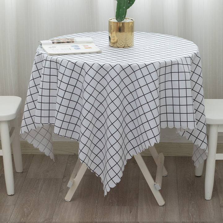 Round washable tablecloth with fine checkered grid pattern and wavy hem