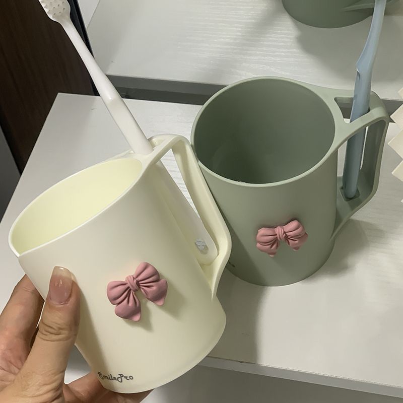 Ceramic mug with elegant bow motif Stornfield