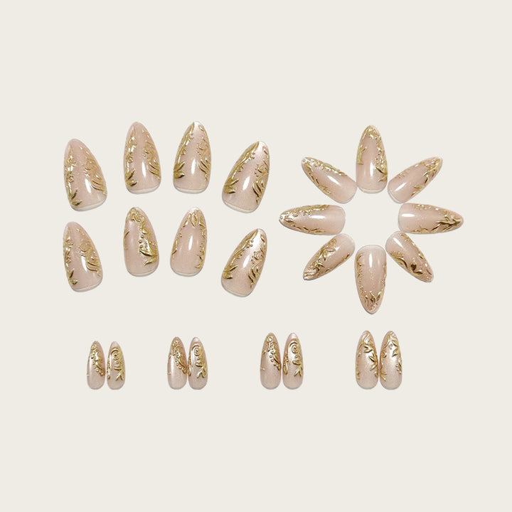 Exquisite artificial nails with golden decorations Stornfield