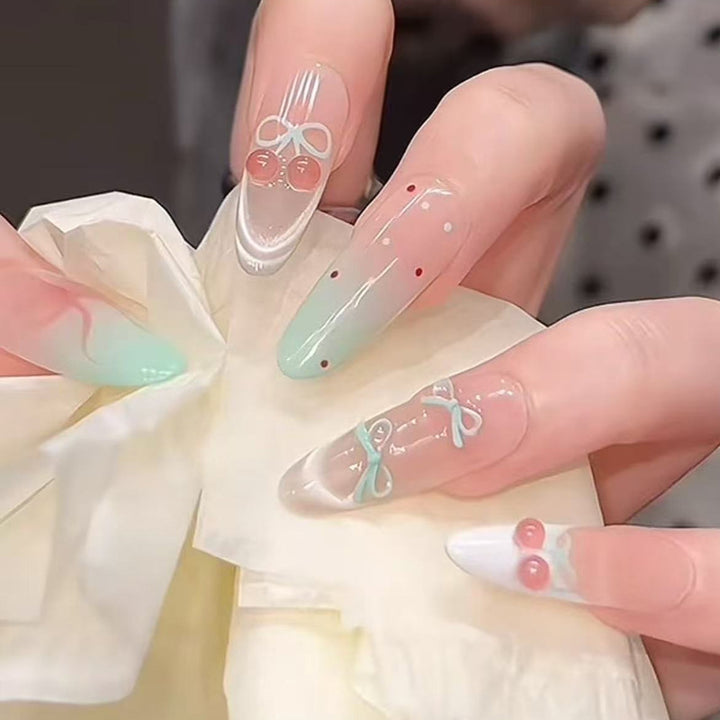 Artificial nail set with elegant bow and cherry designs Stornfield