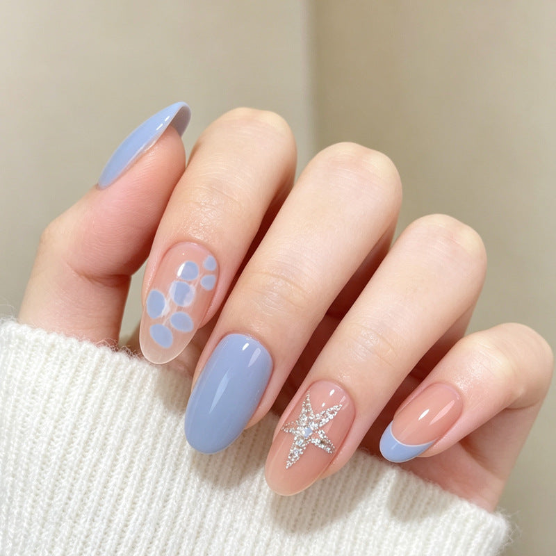 Artificial nail set with elegant patterns and glitter accents Stornfield