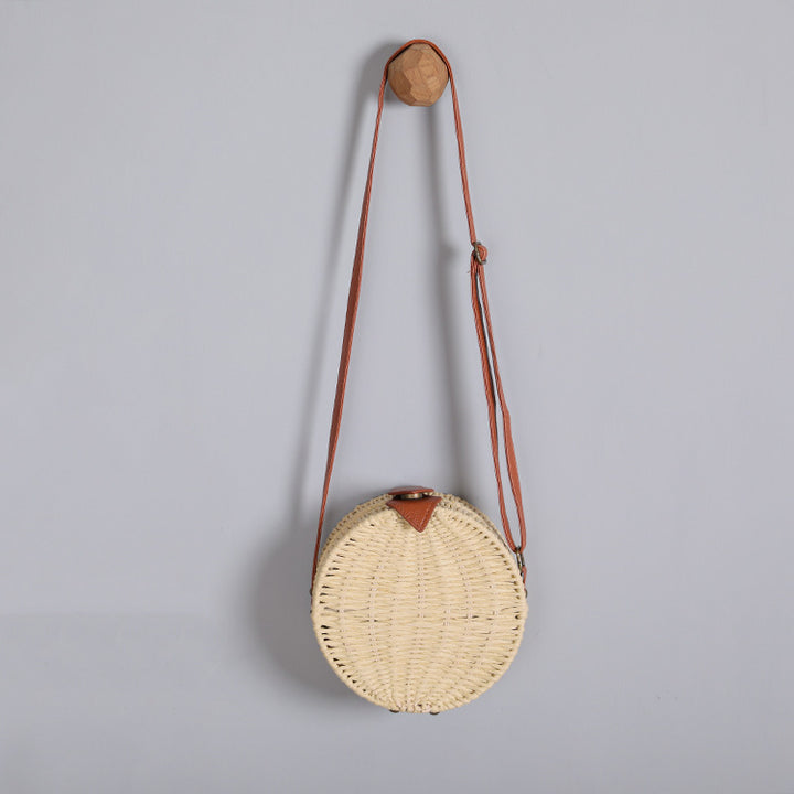 Round basket bag with leather accents Stornfield