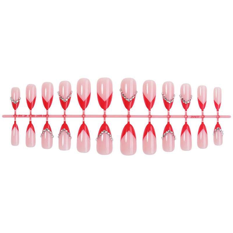 Nail art set with elegant red accents and rhinestone embellishments Stornfield