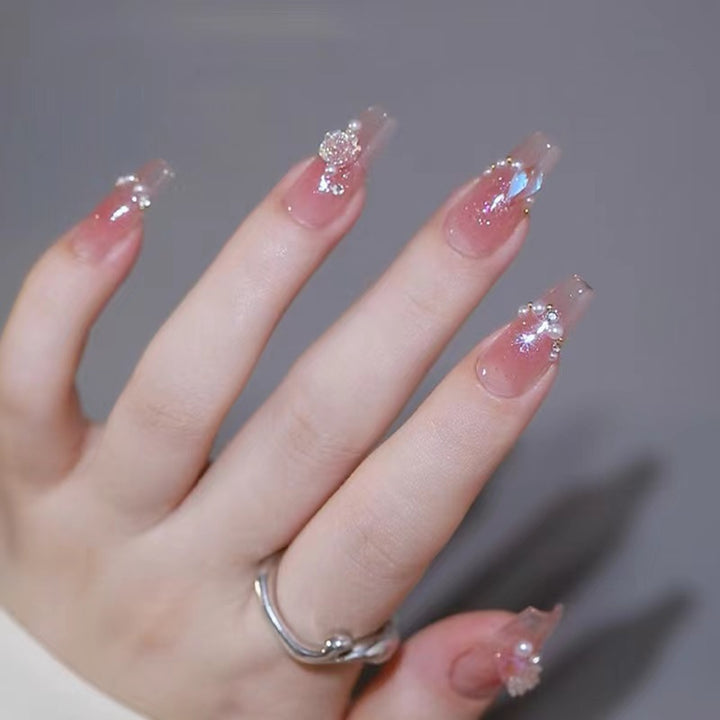 Artificial nails with heart design and glitter accents Stornfield