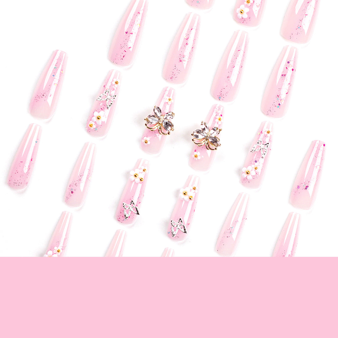 Artistic Nail Extensions with Glitter and Floral Accents Stornfield