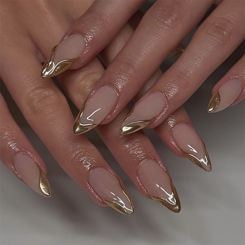 Elegant Stiletto Nails with Shimmering Gold Accent Stornfield