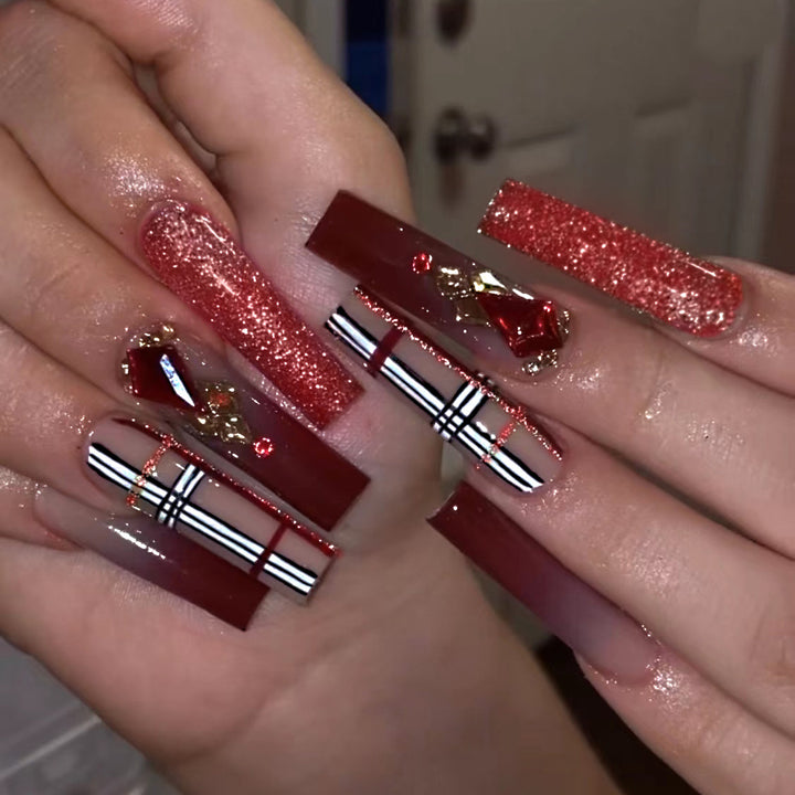 Glamorous stiletto nails with extravagant design and glitter accents Stornfield