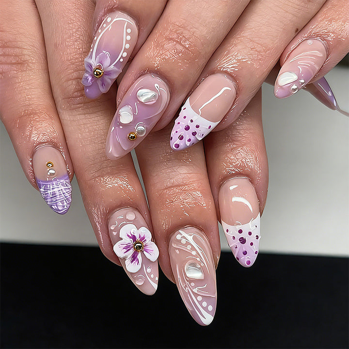 Artificial nail set with exotic floral and glitter accents Stornfield